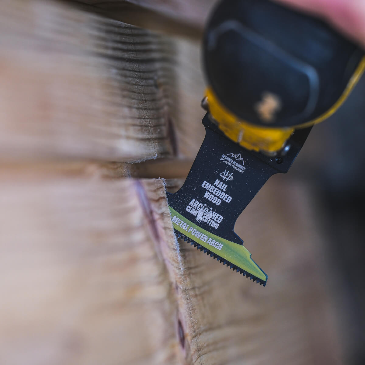 oscillating saw blade cutting wood